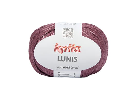 A spool of Katia Lunis yarn in pink color with the brand label visible.
